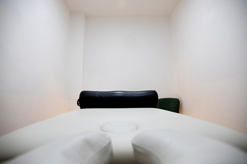 massage room with stretcher and white walls