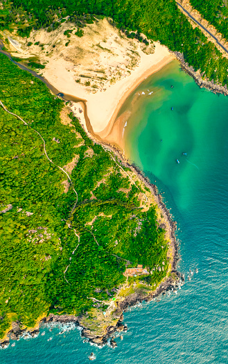 Beautiful bay viewed from above on the sunny morning like a miniature Vietnam map near the lighthouse Dai Lanh, Phu Yen, Vietnam
