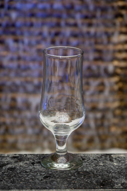 istock Empty glass for juice, water or ice cream on leather cover 1410787847