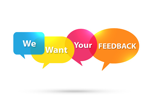 We Want Your Feedback written in multi colored speech bubble on white background