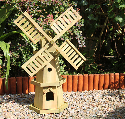 A Decorative Model Wooden Windmill Garden Ornament.