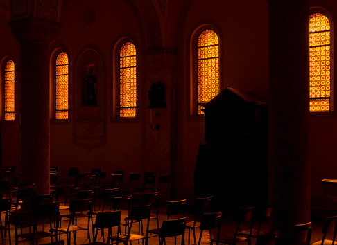 church illuminated by the light coming from the windows at dawn