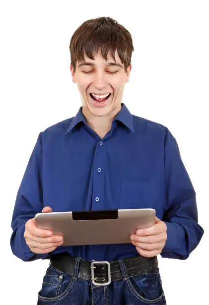 Happy Teenager with Tablet Computer Laughing on the White Background