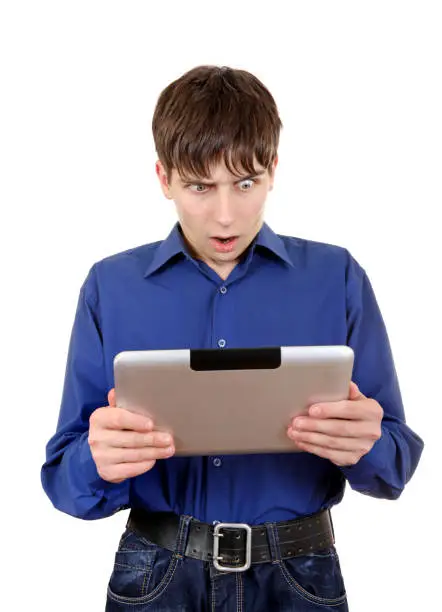 Furious Young Man with Tablet Computer Isolated on the White Background