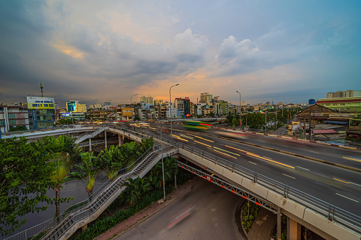Ho Chi Minh city, Vietnam - 22 July 2022: View of Cha Va bridge, Ho Chi Minh City, Vietnam, at rush hour, many vehicles, motorcycle and car together on the road