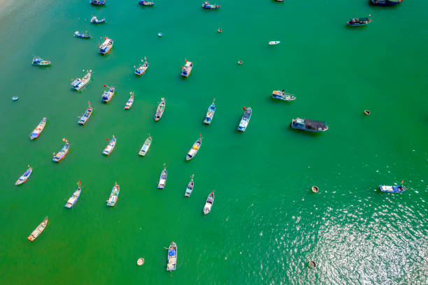 istock Fishing wharf moored to avoid storms at noon in summer 1410796925