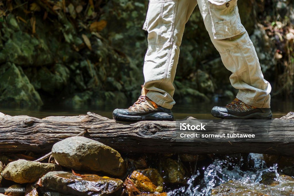 hiking travel lifestyle concept adventure,Cross the stream. Mountain Stock Photo