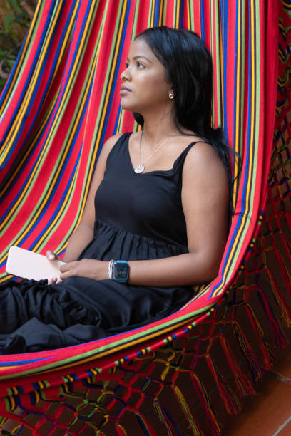 istock African woman resting in a hammock 1410801846