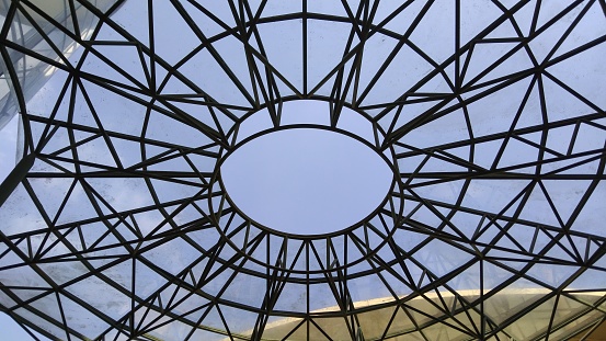 Detail of a steel roof with blue background