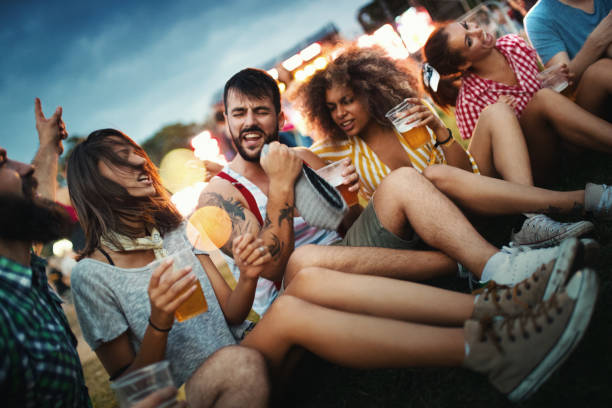 istock Group of friends chilling before a concert. 1410806876