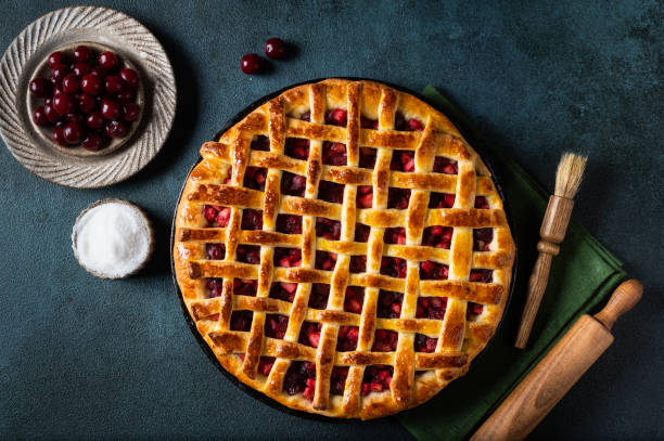 istock Piece of Cherry Pie with a Flaky Crust on dark background. Top view. American pie. Cherry dessert. Flatlay. Cherry filling 1410809949