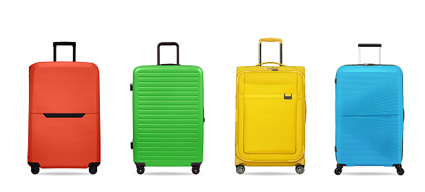 Multi colored suitcases isolated on white background