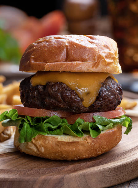 istock Cheeseburger with lettuce and tomato 1410814506