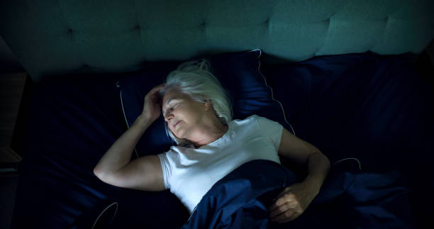 istock Anxious, mature woman falling asleep at night. Dealing with sleeping disorder 1410815844