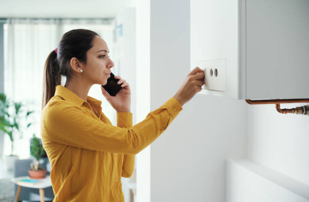 istock Woman calling a boiler breakdown service 1410816022