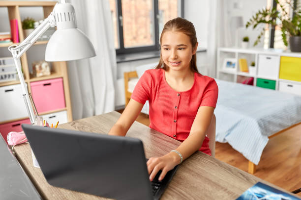 istock student girl with laptop computer learning at home 1410818014