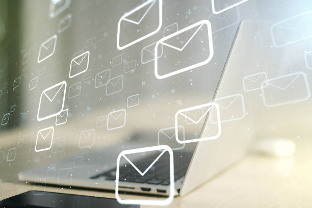 istock Creative concept of postal envelopes illustration on modern laptop background. Email and communications concept. Multiexposure 1410819953