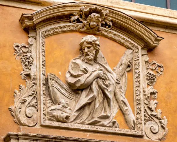 High relief above the entrance of the Oratory of Sant'Andrea dei Pescivendoli, Rome, Italy