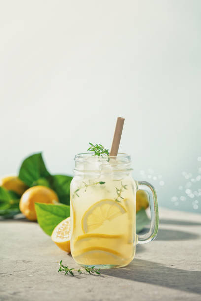 istock Lemonade with ingredients close up. Summer drinks and vacation concept. Sunny day shadows 1410822366