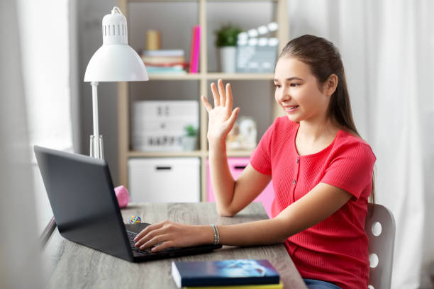 istock student girl with laptop having video call at home 1410822492