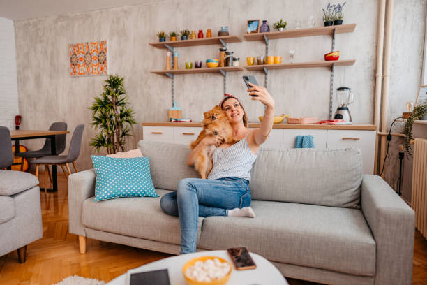 istock Young Woman Taking A Selfie With Her Dog 1410822508