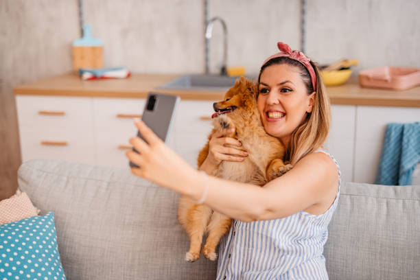 istock Young Woman Taking A Selfie With Her Dog 1410822643