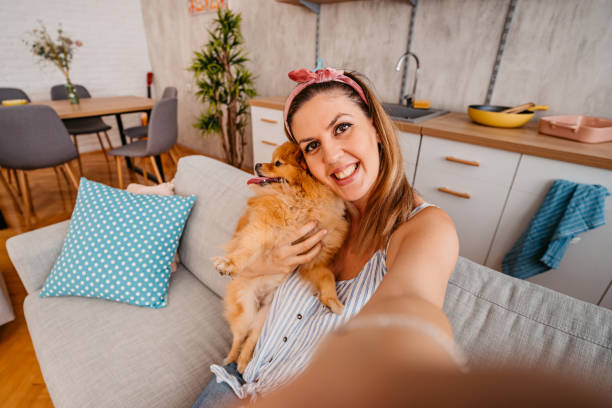 istock Young Woman Taking A Selfie With Her Dog 1410822692