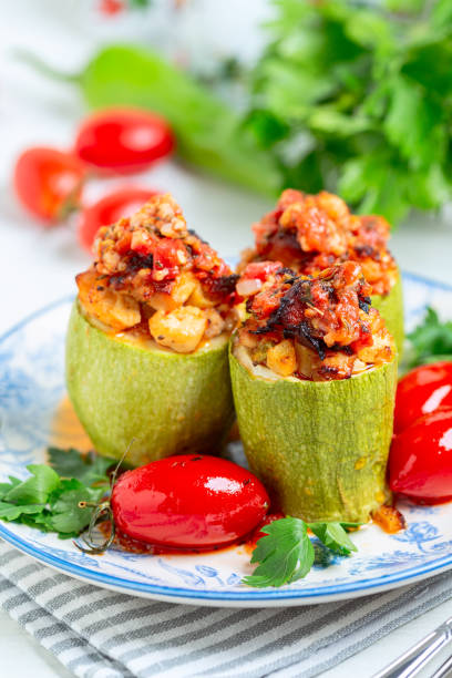 istock Zucchini (squash) stuffed with chicken and vegetables. 1410823697