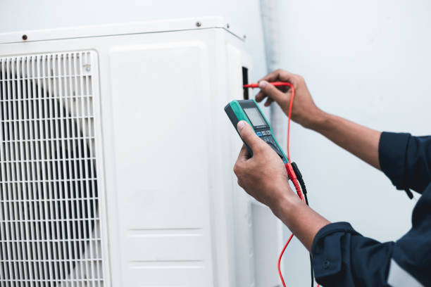 istock Air conditioner technicians use a multimeter to check electricity and Part of the preparation to install a new air conditioner. 1410825038