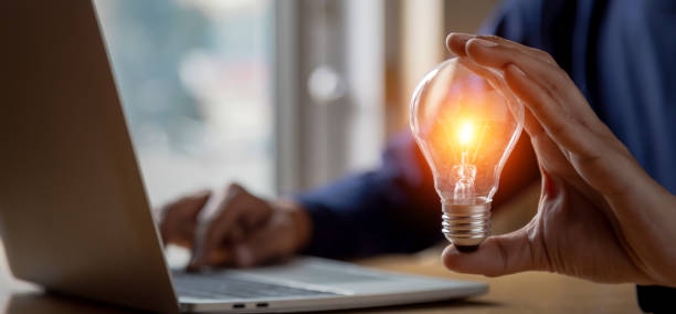 istock Close up hand choose light bulb or lamp with bright for human resources or leadership and creativity thinking idea motivation or vision and knowledge learning. 1410825167
