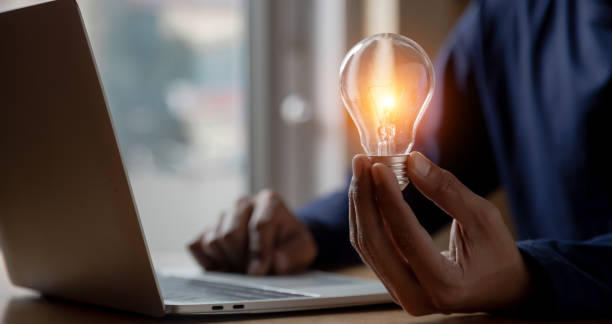 istock Close up hand choose light bulb or lamp with bright for human resources or leadership and creativity thinking idea motivation or vision and knowledge learning. 1410825168