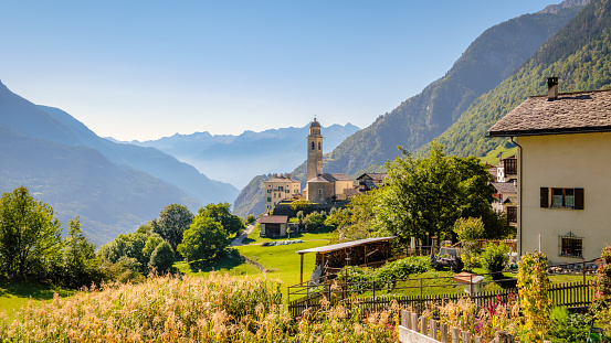 Nice autumn view on the gorgeous village of Soglio, located on a mountainside on the northern side of Val Bregaglia (Grisons, Switzerland). In the background lies the Italian border.