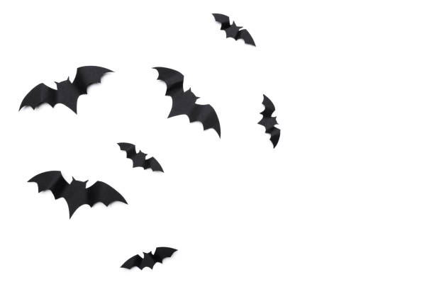 istock halloween and decoration concept - paper bats flying 1410830878