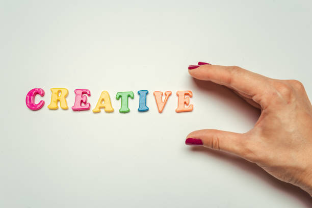 istock Creative concept, word in colorful plastic letters on white background 1410831512
