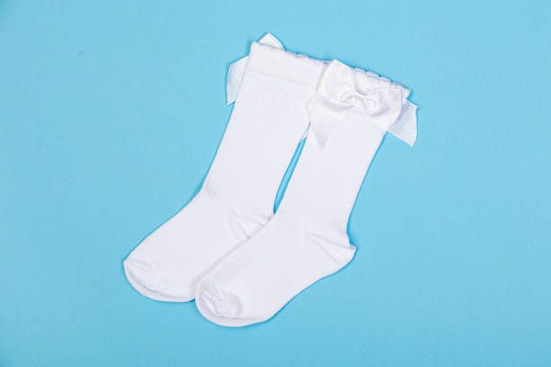 istock high white children's socks with big bows for festive clothes on a blue background 1410831710