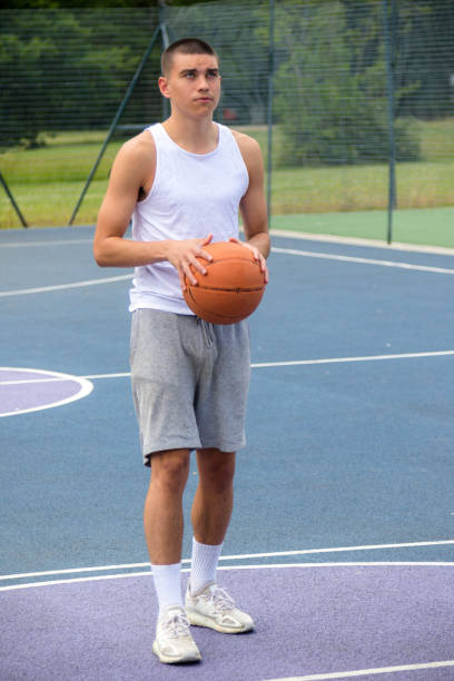 istock A Nineteen Year Old Teenage Boy Playing Basketball 1410831949