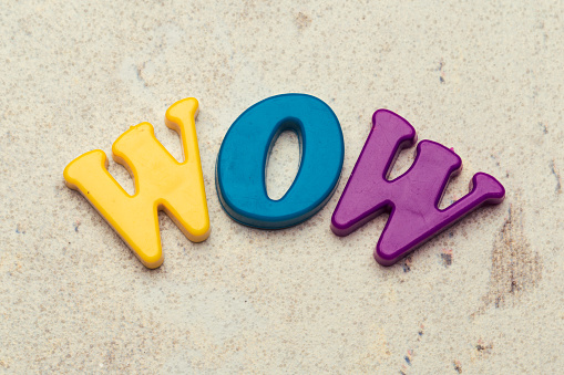 Word Wow written in colorful plastic letters close up shot