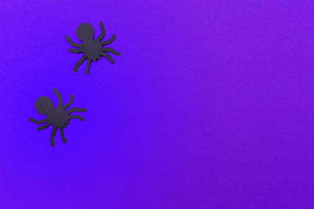 istock halloween and decoration concept - paper bats flying 1410832641