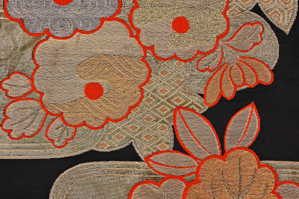 istock Chrysanthemum pattern with autumn leaves in gold on the black belt 1410833774