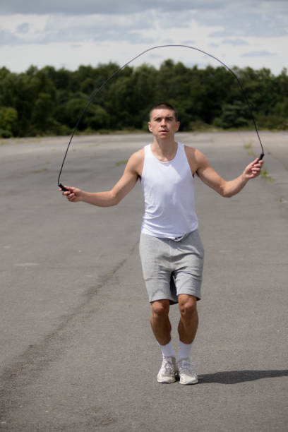 istock A Nineteen Year Old Teenage Boy Using A Skipping Rope in A Public Park 1410833869
