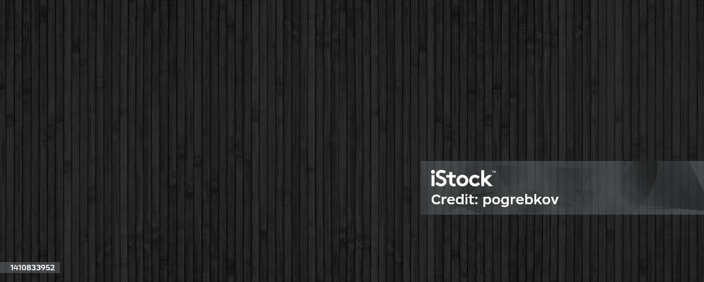 Black bamboo slat wide texture. Abstract wooden backdrop. Textured wood plank dark background Wood - Material Stock Photo