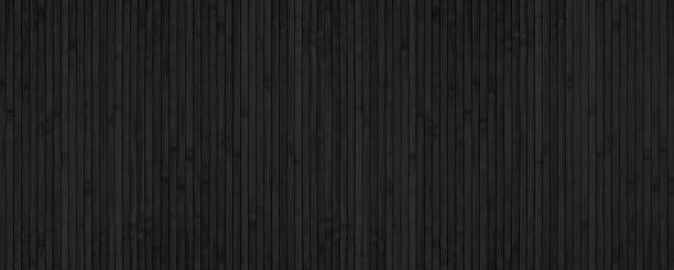 Black bamboo slat wide texture. Abstract wooden backdrop. Textured wood plank dark background Black bamboo slat wide texture. Abstract wooden backdrop. Textured wood plank dark background dark window blinds stock pictures, royalty-free photos & images