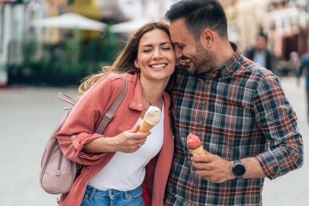 istock Happy couple eating ice cream 1410835184