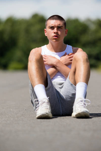 istock A Nineteen Year Old Teenage Boy Doing Situps In A Public Park 1410835360