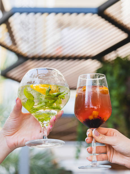 istock a couple drinking cocktails at a celebration 1410835485