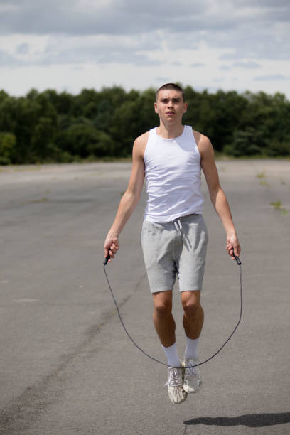 istock A Nineteen Year Old Teenage Boy Using A Skipping Rope in A Public Park 1410835662