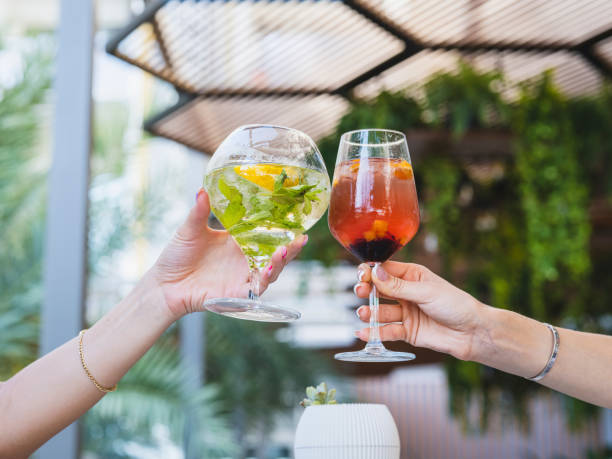 istock a couple drinking cocktails at a celebration 1410837168