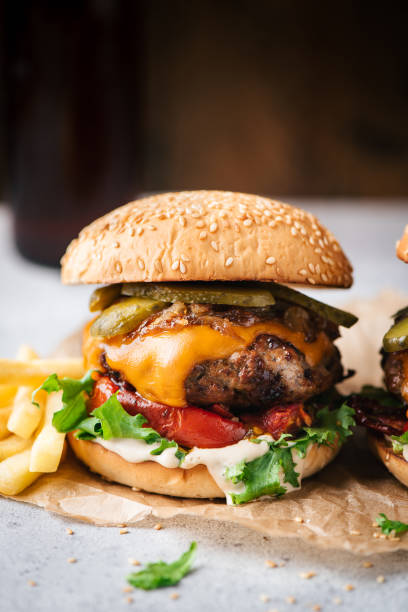 Juicy Craft Cheeseburger With Roasted Pepper stock photo