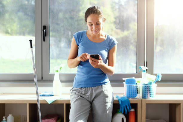 Young housewife using a smartphone stock photo