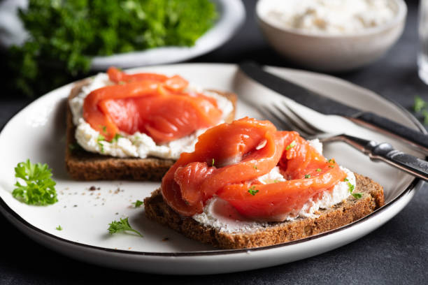 Rye bread sandwich with salmon and cream cheese stock photo